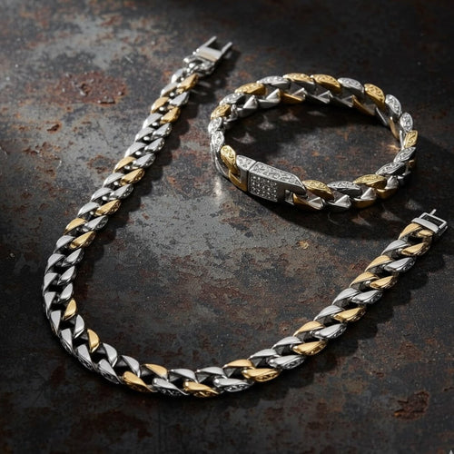 Bracelet with gold and silver chain on a textured dark surface.  Curb Vine Men&