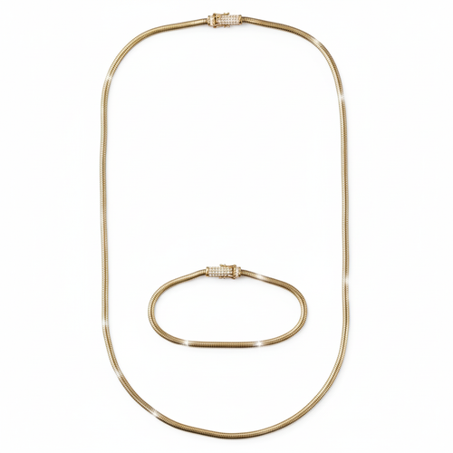 Gold necklace and bracelet set on a white background