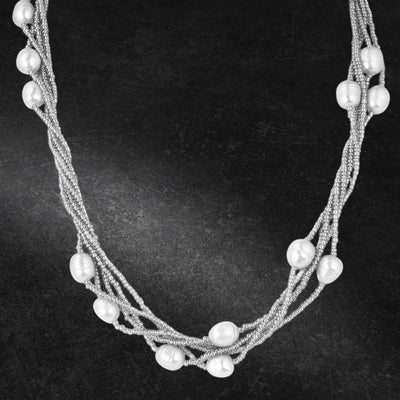 Dove Silver Pearl Necklace featuring multiple strands of delicate silver beads interspersed with lustrous pearls, designed for women’s elegant jewelry collections.