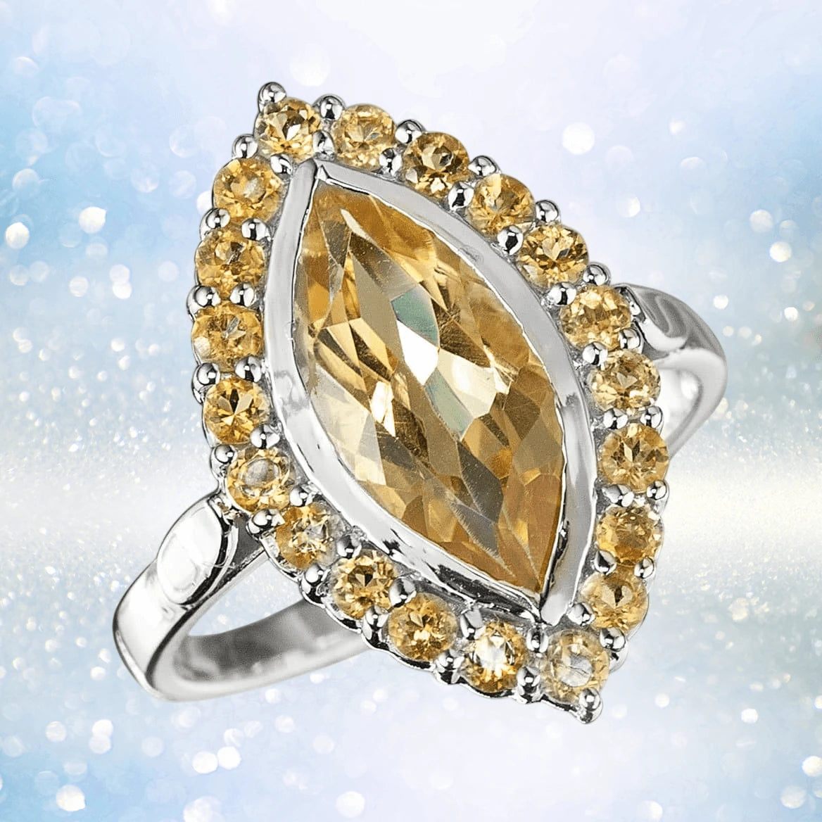 Citrine Solaris Ring featuring a marquise-cut yellow citrine gemstone surrounded by smaller citrine stones set in sterling silver, designed for women’s elegant jewelry collections.