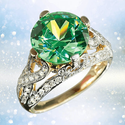 Fauna Ring featuring a large green gemstone set in sterling silver with gold plating, accented by intricate detailing and sparkling small diamonds, designed for women.