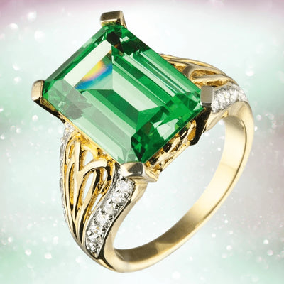 Harlequin Ring featuring a large emerald-cut green gemstone set in sterling silver with gold plating, accented by sparkling white stones for a luxurious female jewelry piece.