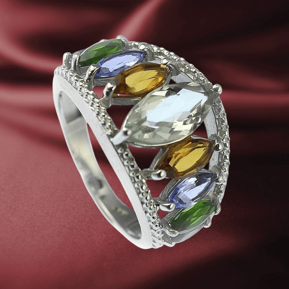 Ariana Ring featuring sterling silver band adorned with marquise-cut multicolored gemstones including green, blue, yellow, and clear stones, elegant female jewelry piece.