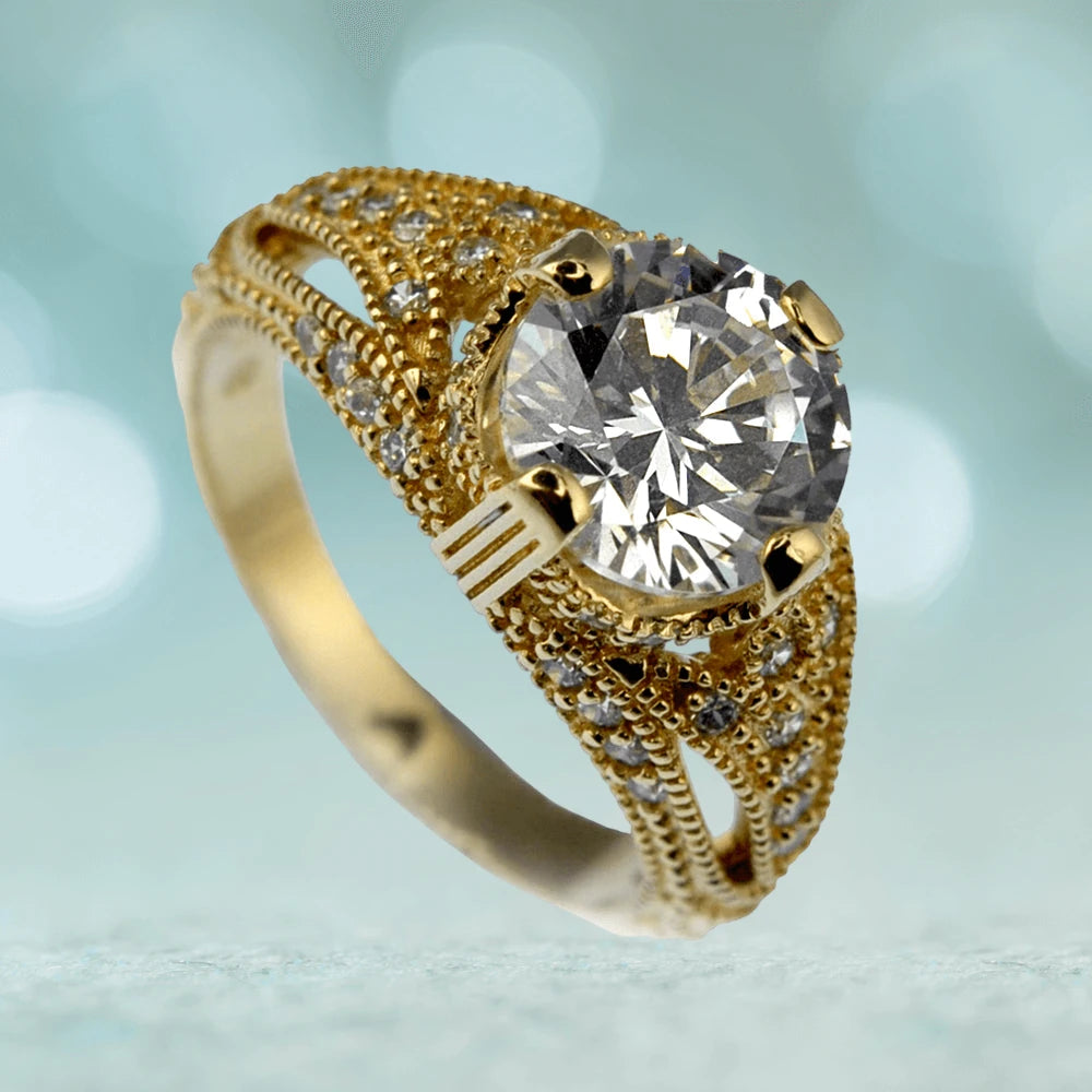 Eldorado Ring featuring a large round clear gemstone set in sterling silver with gold plating, designed for women with intricate detailing and smaller accent stones.