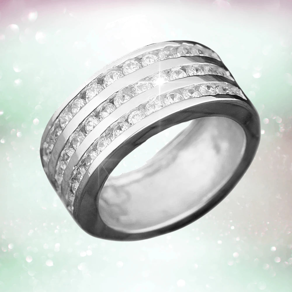 Galaxy Ring Rhodium crafted from sterling silver with rhodium plating, featuring three rows of sparkling stones, designed as a unisex jewelry ring.