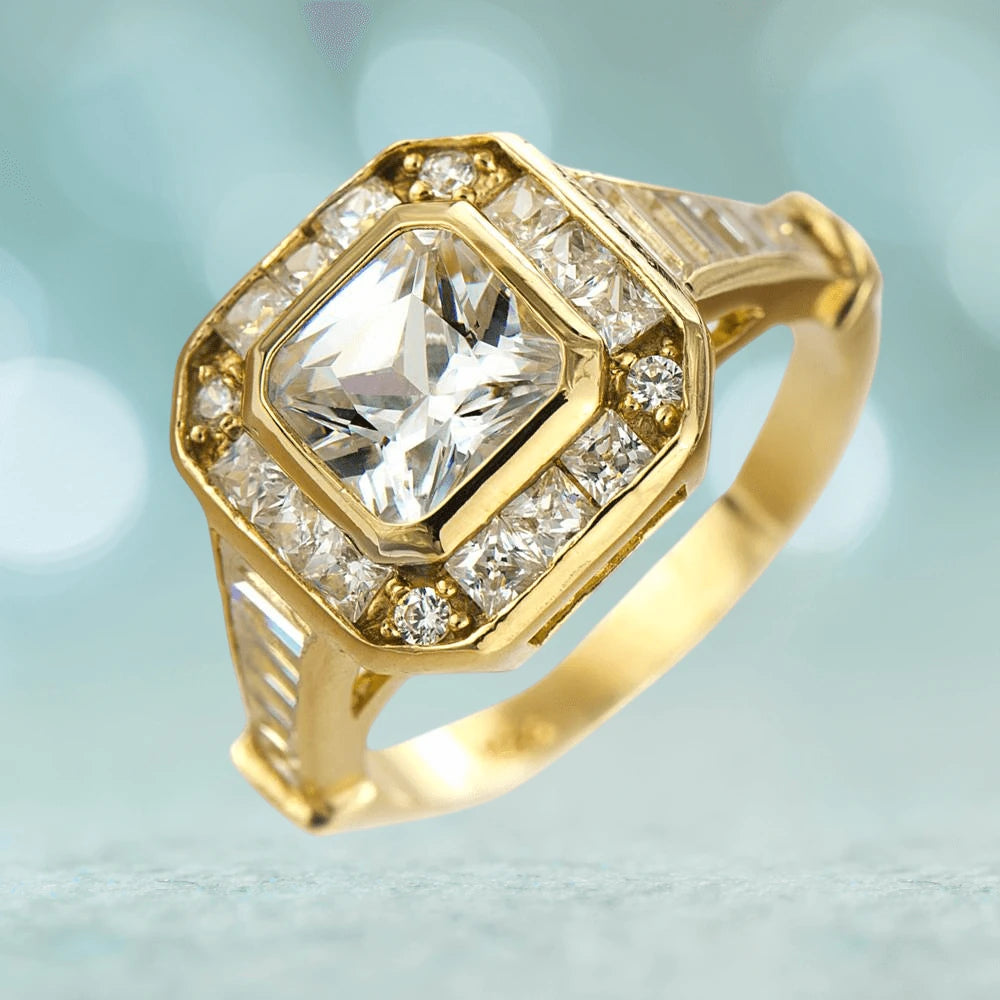 Valencia Deco Ring featuring a gold plated sterling silver band with a large square-cut central stone surrounded by smaller round-cut clear gemstones, designed for women.