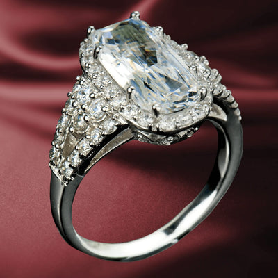 Glacier Rhodium Ring featuring a large rectangular clear stone surrounded by smaller sparkling stones, crafted from sterling silver with rhodium plating, designed for women.