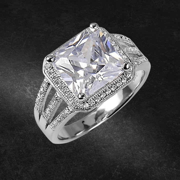 Manhattan Ring featuring a large square-cut center stone set in sterling silver with rhodium plating, designed for women, accented with pavé-set smaller stones on the band.