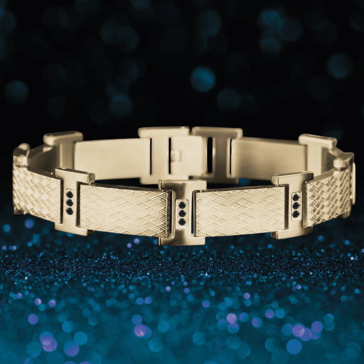 Rafferty Steel Bracelet crafted from gold plated stainless steel for men, featuring textured rectangular links with black stone accents, perfect for stylish jewelry collections.