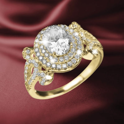 Rococo Ring featuring a sterling silver base with gold plating, adorned with a large central clear gemstone surrounded by smaller sparkling stones, elegant female jewelry design.