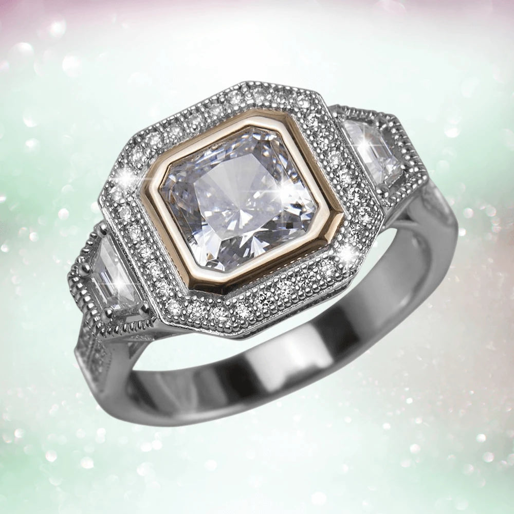 Dakota Ring featuring a two-tone sterling silver band with a central square-cut gemstone surrounded by smaller sparkling stones, designed for women’s jewelry collections.