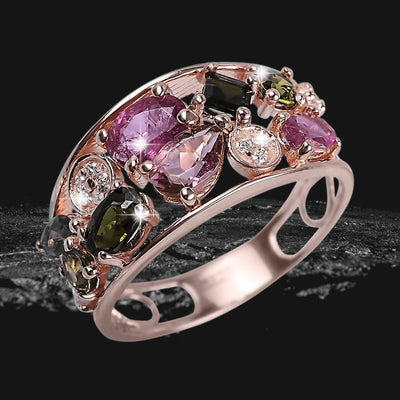 Tourmaline Spice Ring featuring a sterling silver band with rose gold plating, adorned with multi-colored tourmaline gemstones and sparkling accents, designed for female jewelry enthusiasts.