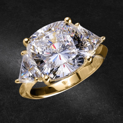 Infinity Ring featuring a large, sparkling center stone with two trapezoid-cut side stones set in sterling silver with gold plating, designed for female jewelry enthusiasts.