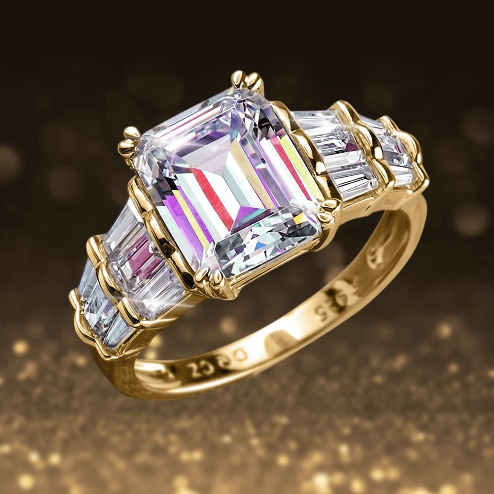 Golden Palace Ring featuring a large emerald-cut center stone and baguette side stones set in sterling silver with gold plating, designed for women’s jewelry collections.