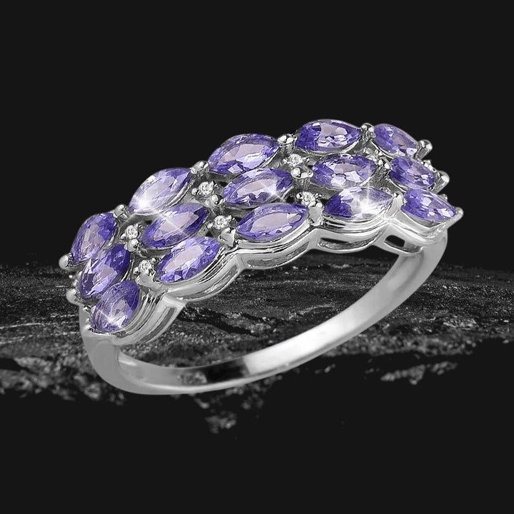 Tamia Tanzanite Ring featuring multiple marquise-cut tanzanite stones set in sterling silver with rhodium plating, designed for a sophisticated female jewelry collection.