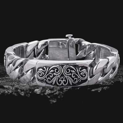 Montana Scroll Bracelet Steel made of stainless steel for men, featuring a bold, polished chain design with an intricate scroll pattern centerpiece.