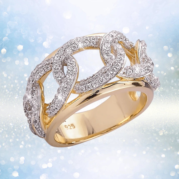 Catena Ring in sterling silver with gold plating, featuring an intricate chain-link design encrusted with sparkling stones, elegant jewelry for women.