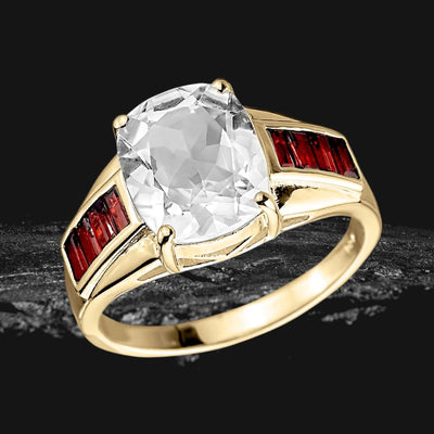 Arctic Quartz Men's Ring featuring a large clear quartz center stone set in sterling silver with gold plating and accented by rectangular red gemstones on each side, designed for men.