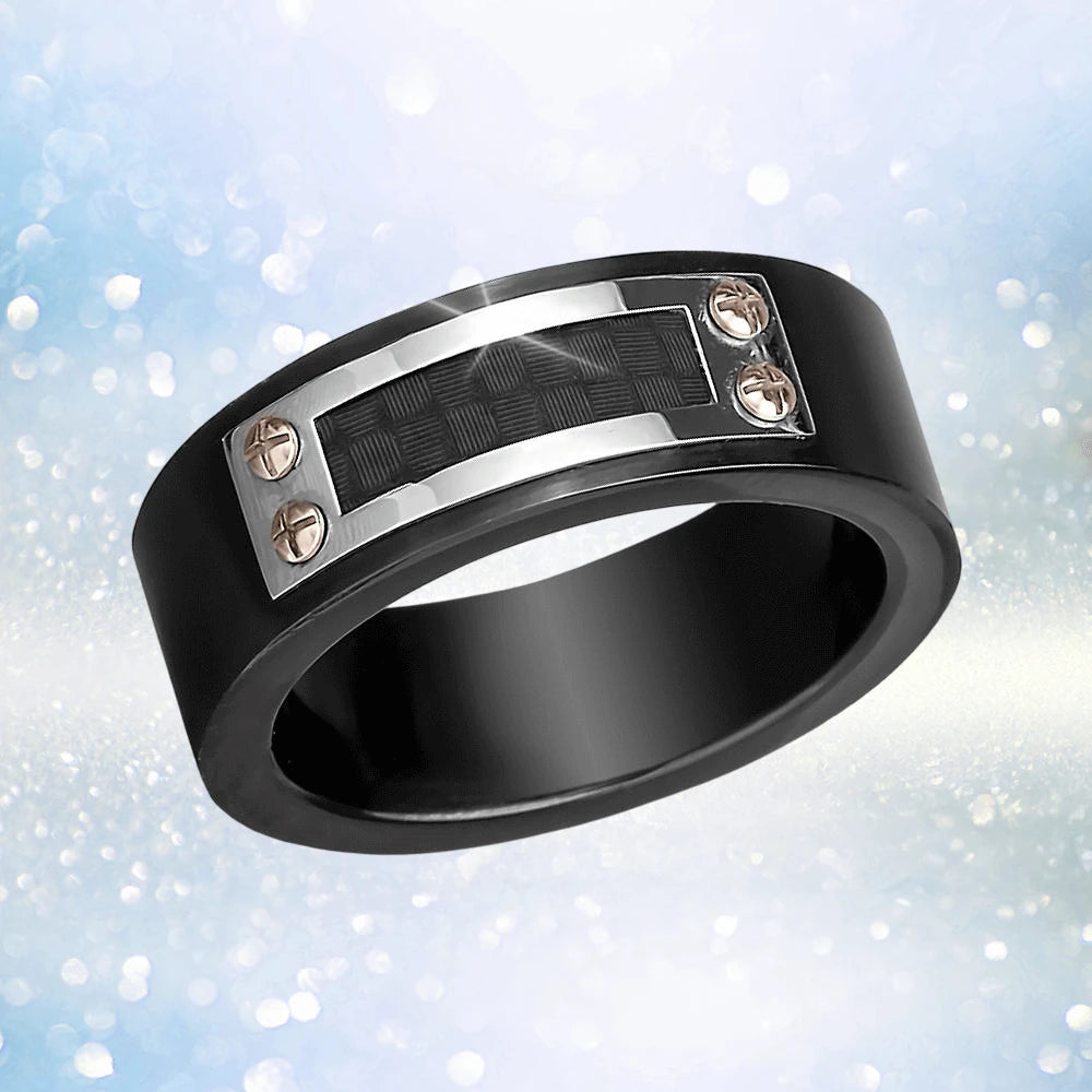 Dynamo Men's Ring in IP Black stainless steel featuring a textured rectangular inlay secured by four screws, showcasing a modern and masculine design for men’s jewelry.