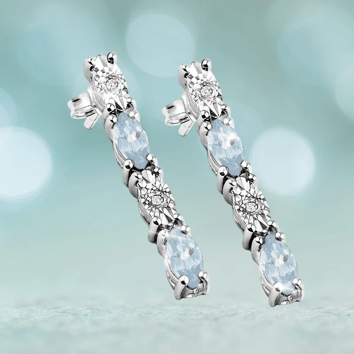 Navette Topaz Earrings crafted in sterling silver with rhodium plating, featuring alternating topaz and sparkling clear stones for an elegant female jewelry statement.