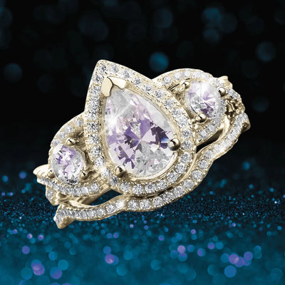 Louis Duo Ring crafted in sterling silver with gold plating, featuring a pear-shaped center stone and two smaller round stones, all surrounded by sparkling accents, designed for women.