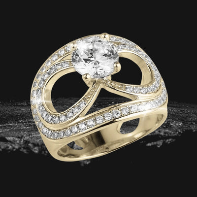 Infinity Solitaire Ring in gold-plated sterling silver featuring a sparkling round solitaire center stone and elegant infinity-inspired design encrusted with smaller crystals.