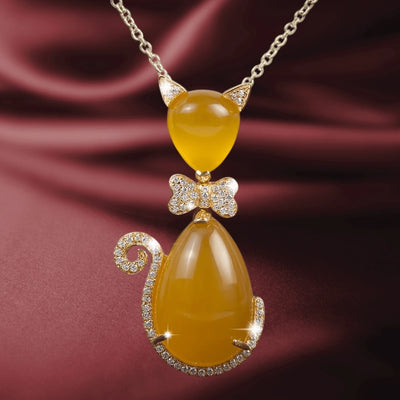 Bow Cat Tangerine Pendant featuring sterling silver in rose gold plating, with a cat-shaped design in tangerine-colored stones and sparkling crystal accents, elegant jewelry for women.
