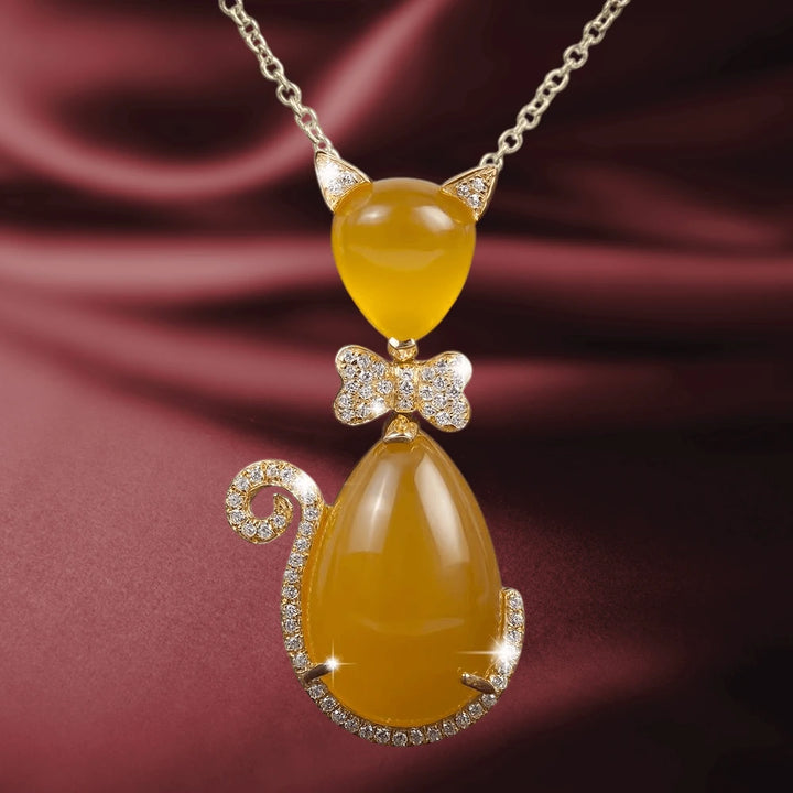Bow Cat Tangerine Pendant featuring sterling silver in rose gold plating, with a cat-shaped design in tangerine-colored stones and sparkling crystal accents, elegant jewelry for women.