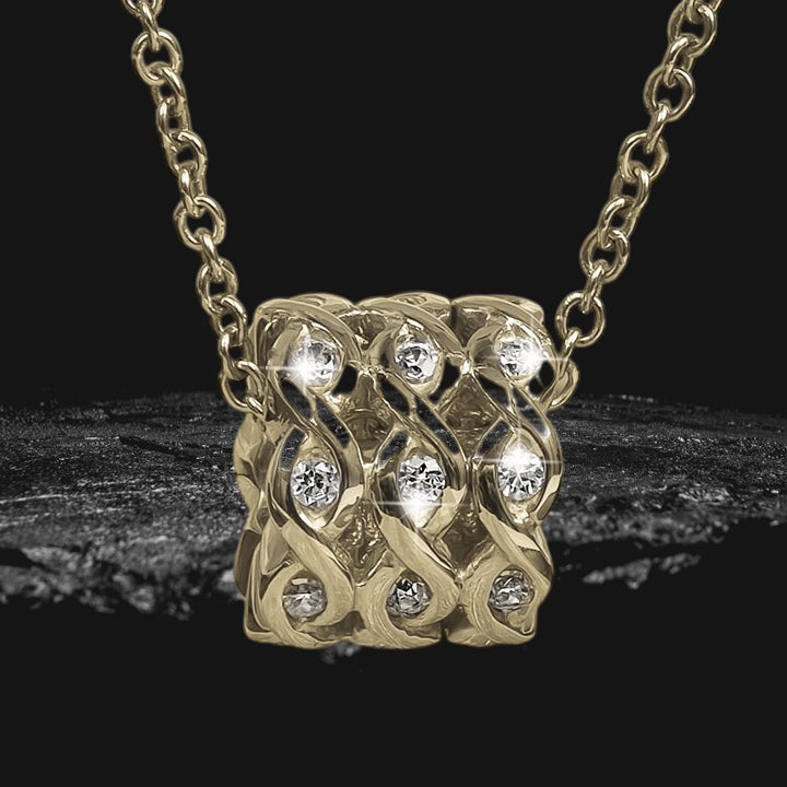 Ipanema Gold Pendant featuring a sterling silver base with gold plating, designed for women, showcasing an intricate pattern studded with sparkling clear gemstones on a delicate chain necklace.