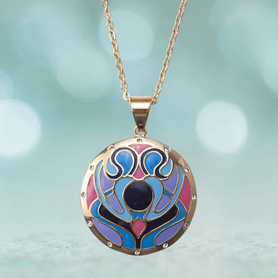 Golden Peacock Pendant featuring stainless steel construction with a colorful peacock-inspired design in blue, purple, and pink hues on a delicate chain necklace for women.