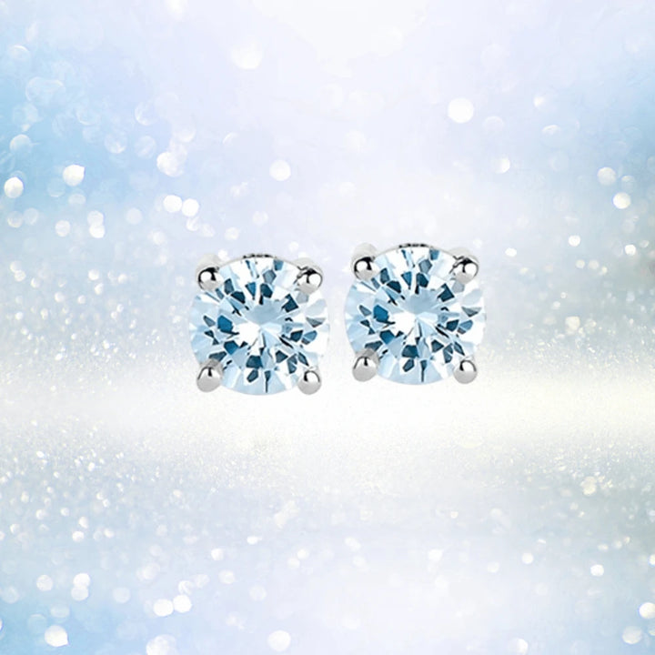 Brilliant Birthstones Earrings March featuring round aquamarine gemstones set in sterling silver with rhodium plating, designed for a refined female jewelry collection.