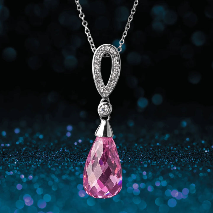 Candy Briolette Pendant featuring a sterling silver and rhodium plated setting with sparkling white stones and a faceted pink briolette drop, designed for women’s jewelry.