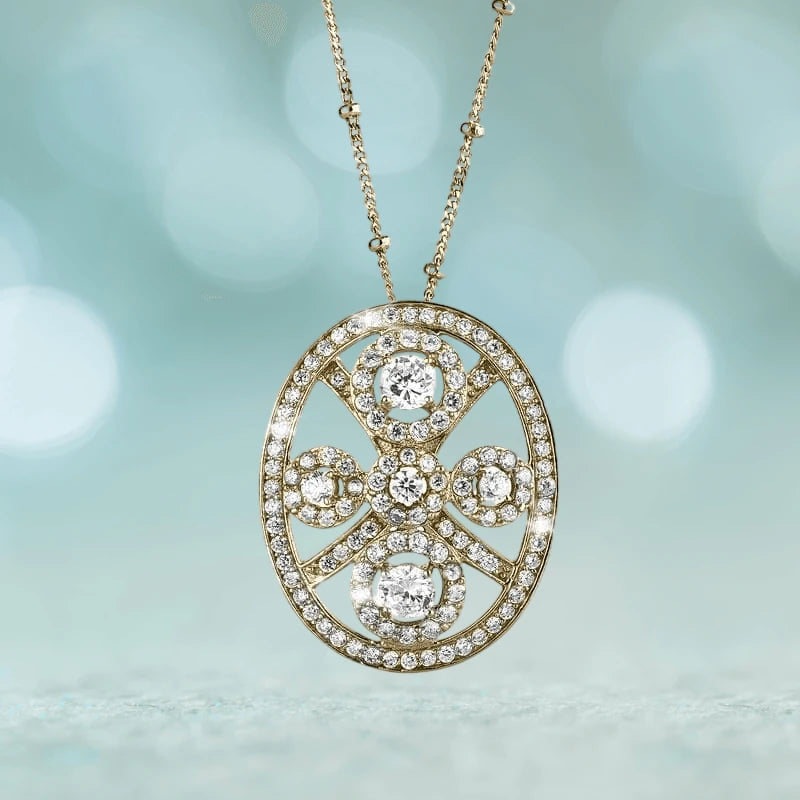 Decora Ladies' Pendant crafted in sterling silver with gold plating, featuring an oval design encrusted with sparkling clear stones on a delicate gold chain necklace.