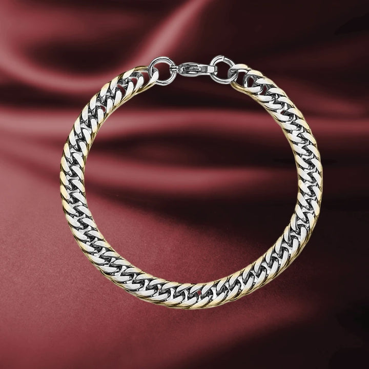 Double Curb Gold Edged Bracelet for men, crafted from stainless steel with a sleek gold edge design, resting on a rich burgundy fabric background.
