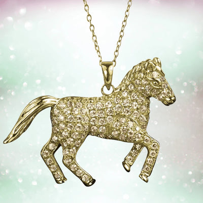 Wild Pony Gold Pendant featuring a sterling silver horse shape with gold plating, encrusted with sparkling stones on a delicate gold chain, designed for women’s jewelry.