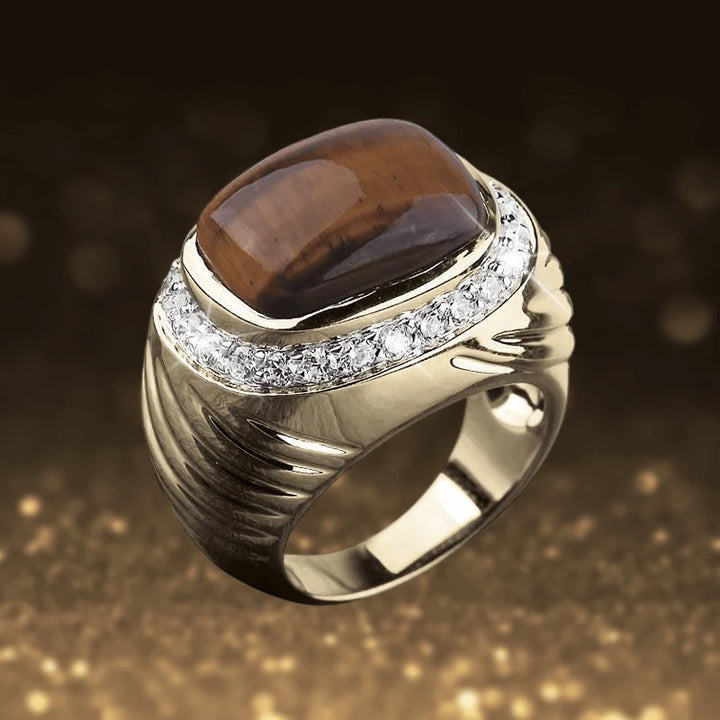 Cougar Tigers Eye Ring crafted in sterling silver with gold plating, featuring a polished brown tiger's eye stone and a border of sparkling clear gemstones for men.