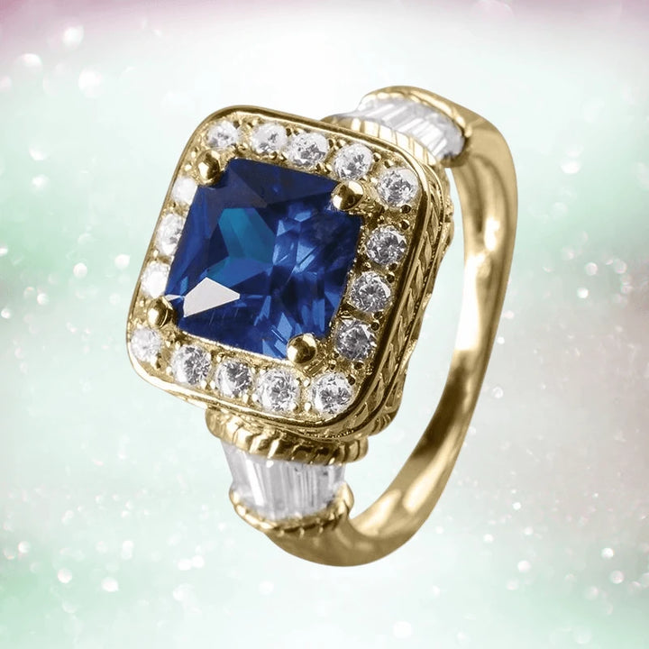 Princesa Azul Ring featuring a large blue square gemstone surrounded by sparkling clear stones set in sterling silver designed for women.