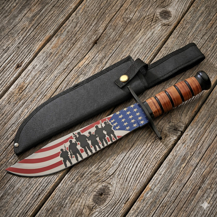 Freedom Fighter Bowie Knife featuring an American flag design blade with soldier silhouettes and a leather-wrapped handle resting on a wooden surface beside a black sheath.