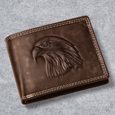 Eagle Predator Leather Wallet in brown leather with a detailed embossed eagle head and contrasting stitched trim on a soft gray surface Up To 75% Off Retail