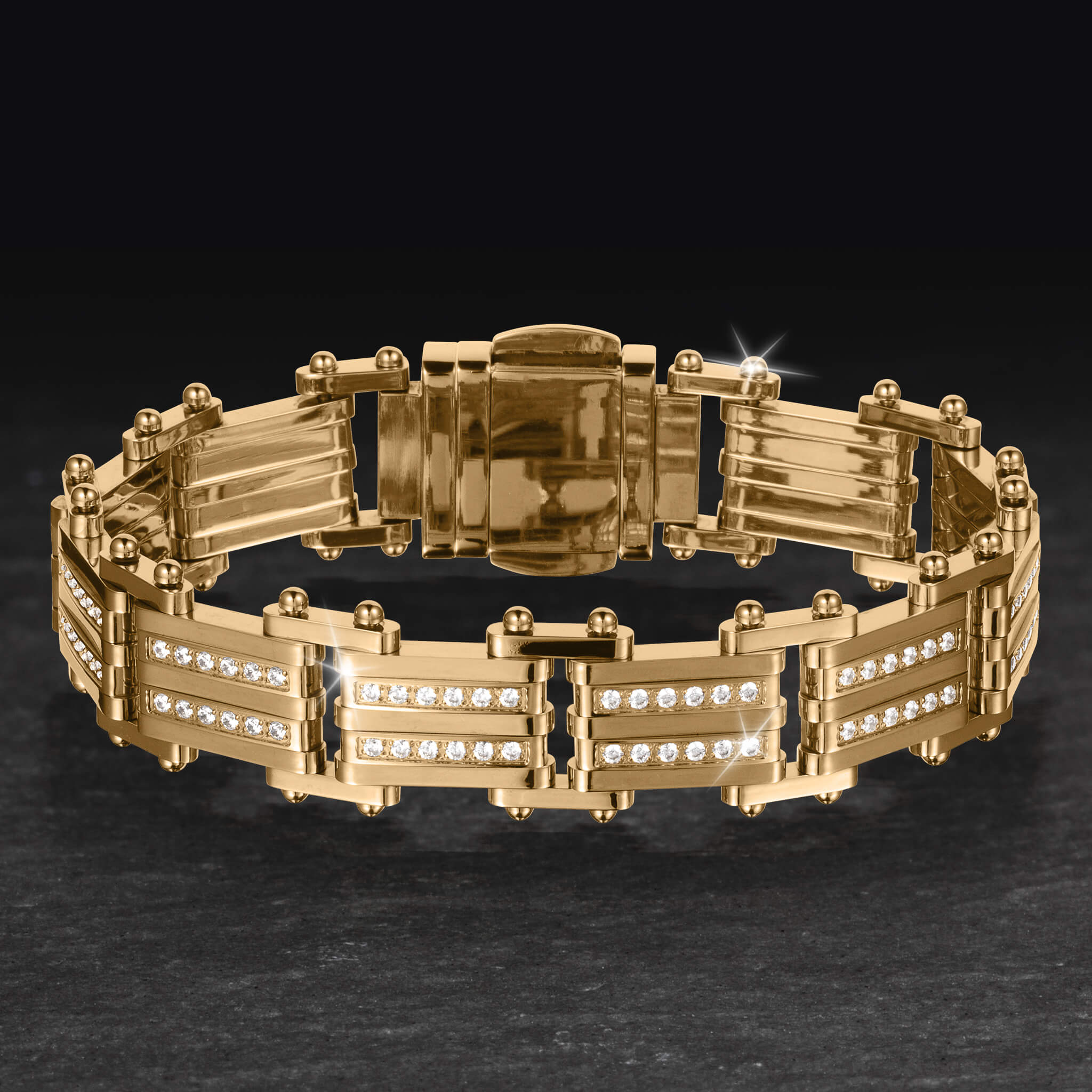 Modex Bracelet in polished gold tone metal with crystal accented panels and secure fold over clasp displayed on a dark surface Up To 75% Off Retail