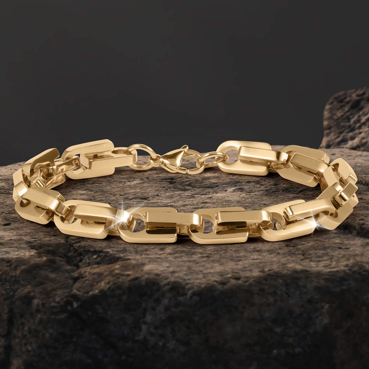 Moderna Link Collection gold link bracelet with polished reflective finish displayed on textured stone Up To 75% Off Retail