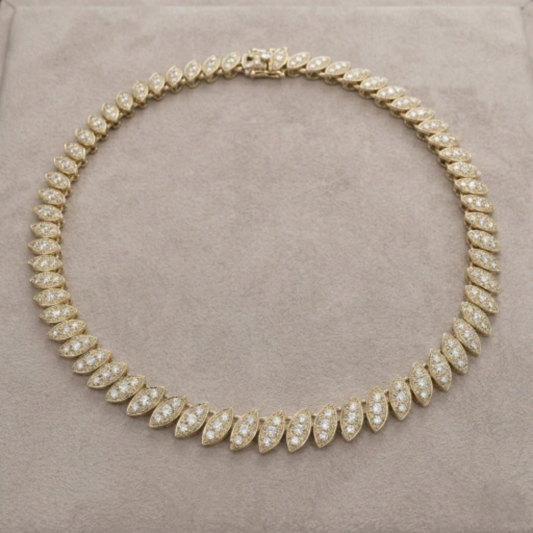 Captivating Leaf Necklace for female featuring gold plating with sparkling leaf-shaped segments forming an elegant jewelry necklace.