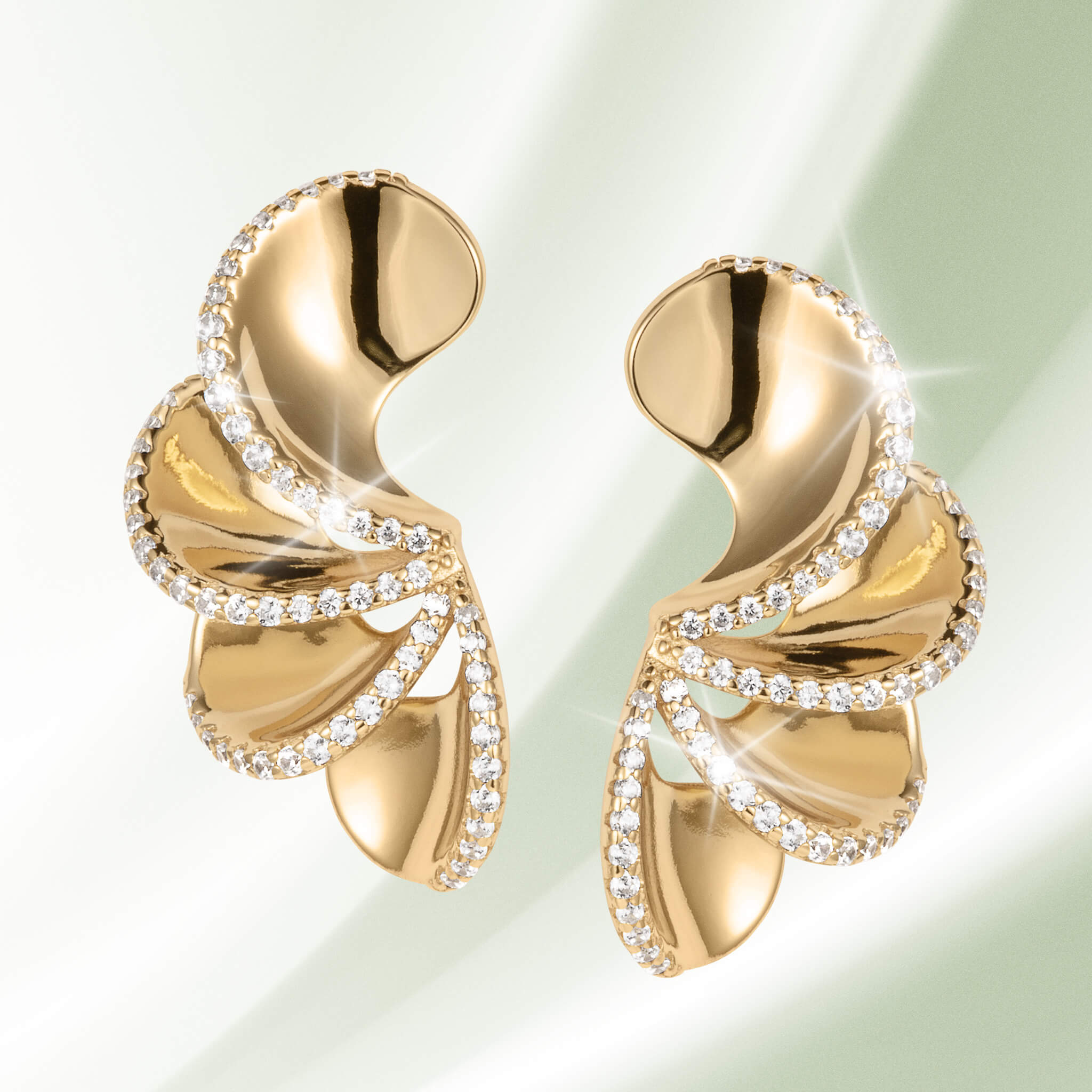 Arianna Earrings featuring elegant gold-toned curved design accented with sparkling crystals, perfect for adding a luxurious touch to any jewelry collection. Up To 75% Off Retail.