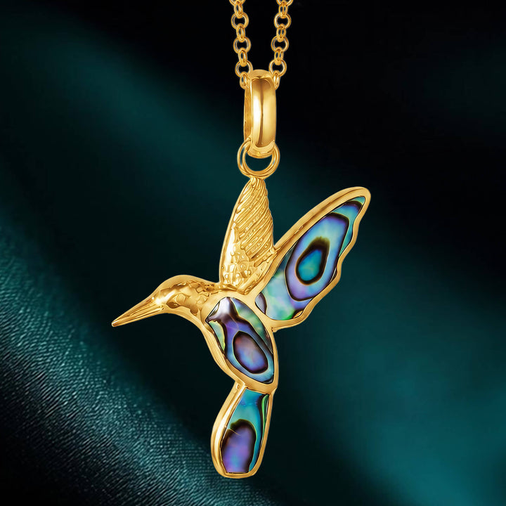 Elegant gold hummingbird pendant featuring iridescent shell inlays, part of the Golden Abalone Hummingbird Collection, perfect collectible jewelry with Up To 75% Off Retail.
