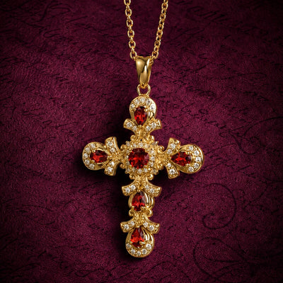 Elegant gold cross pendant adorned with deep red garnet stones and sparkling crystals on a delicate chain, named Crimson Covenant Garnet Cross, jewelry accessory.