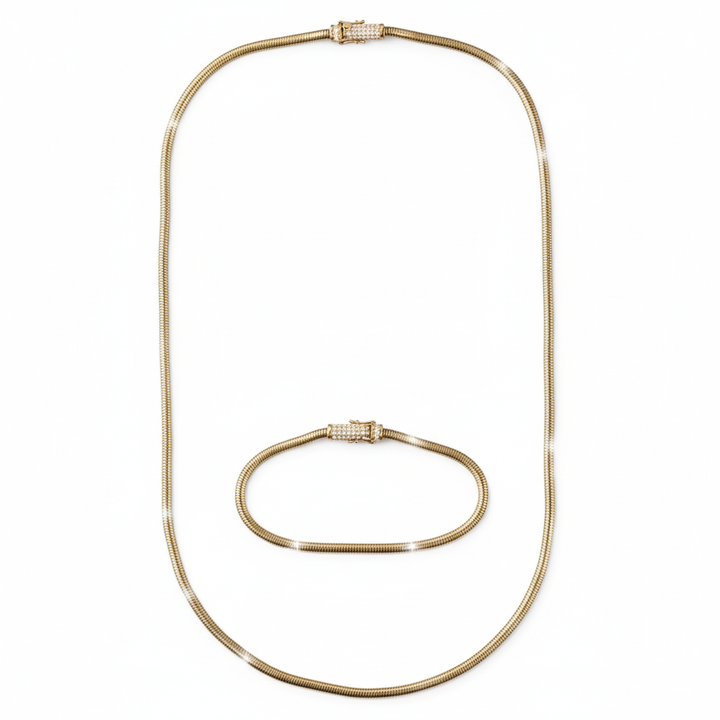 Gold necklace and bracelet set on a white background