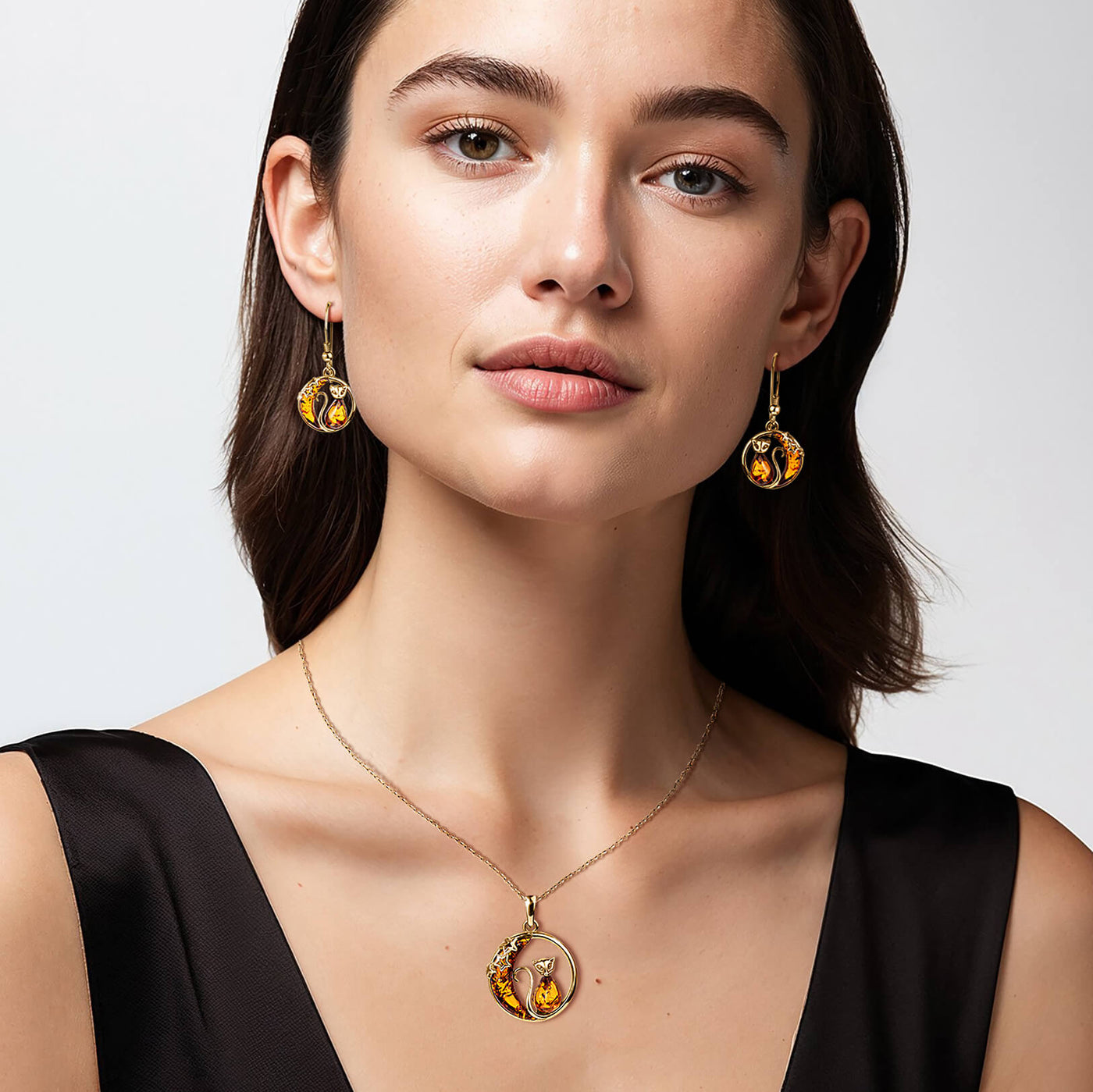 Women wearing amber cat jewelry