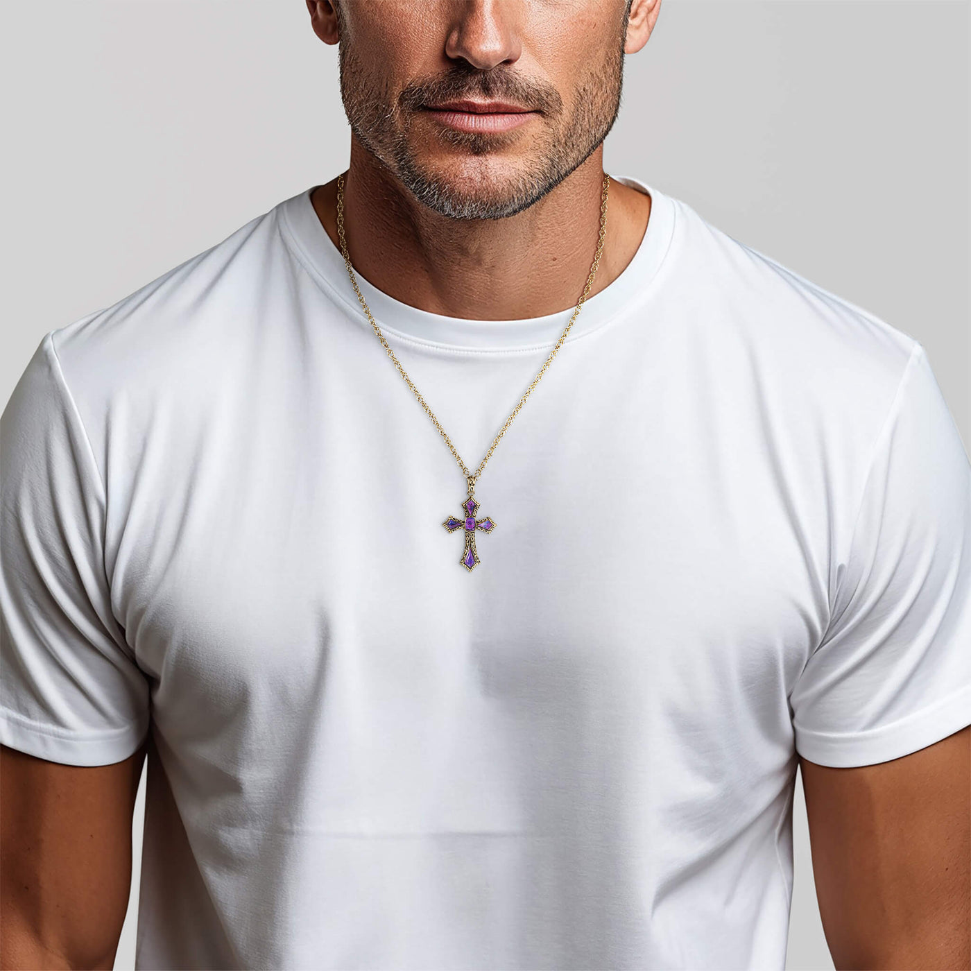 Man in white t-shirt wearing purple cross pendant