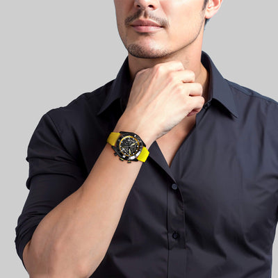 Man wearing yellow sports watch