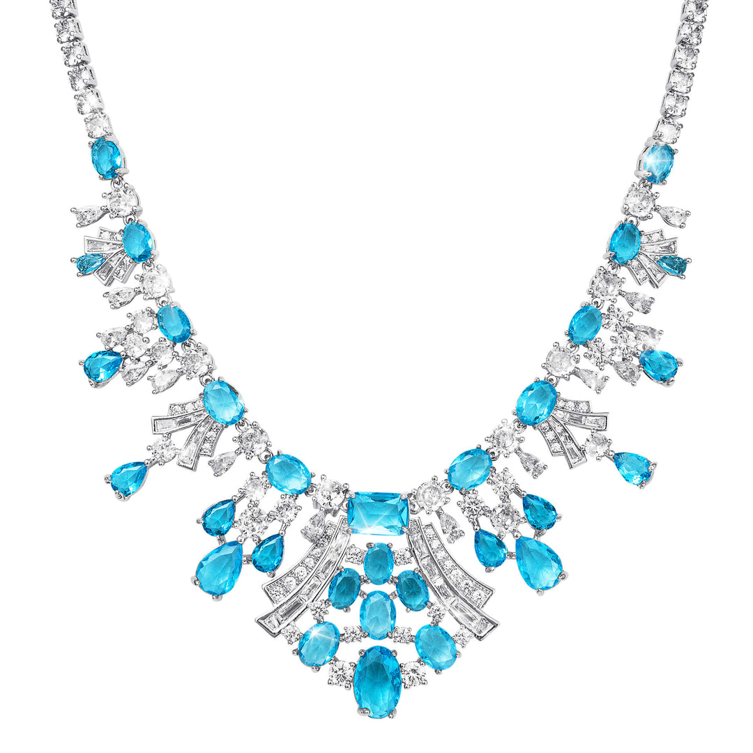 Elegant necklace with blue gemstones and silver accents on a white background